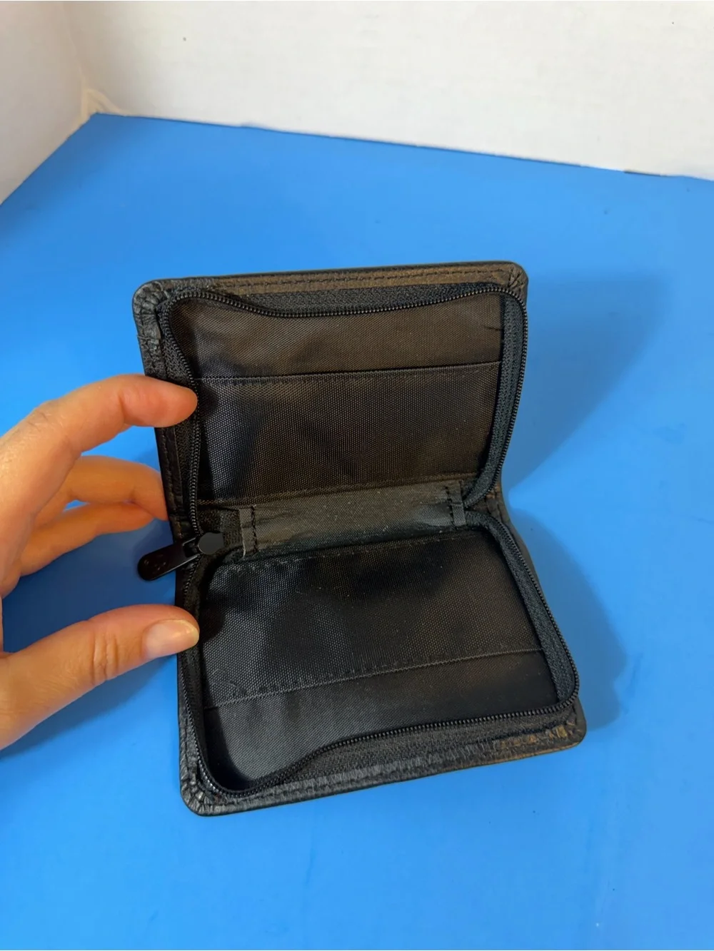 Black Leather Bi-Fold Wallet with Embossed Logo